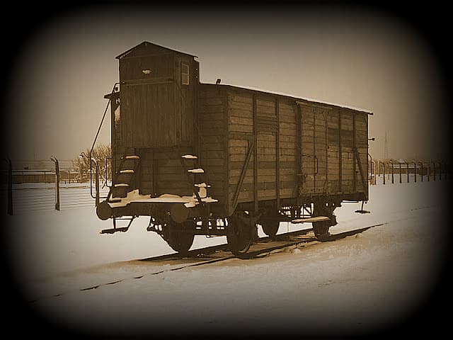A train car on a snowy track AI-generated content may be incorrect.