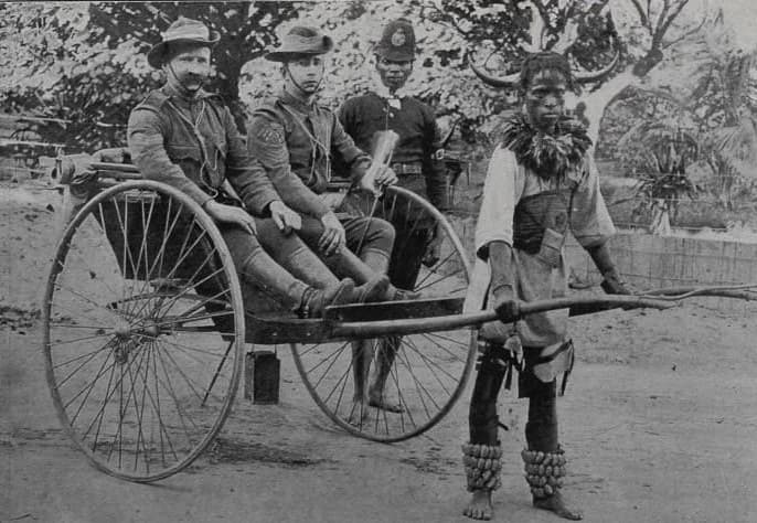 A group of men in clothing in a cart AI-generated content may be incorrect.